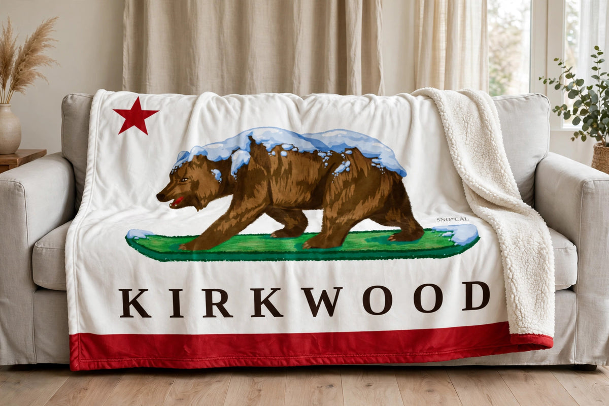 Kirkwood sherpa blanket draped over a sofa