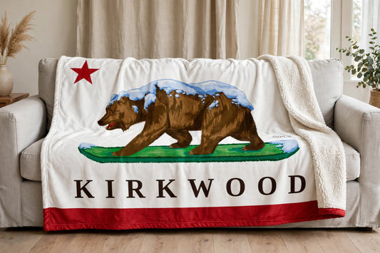 Kirkwood sherpa blanket draped over a sofa