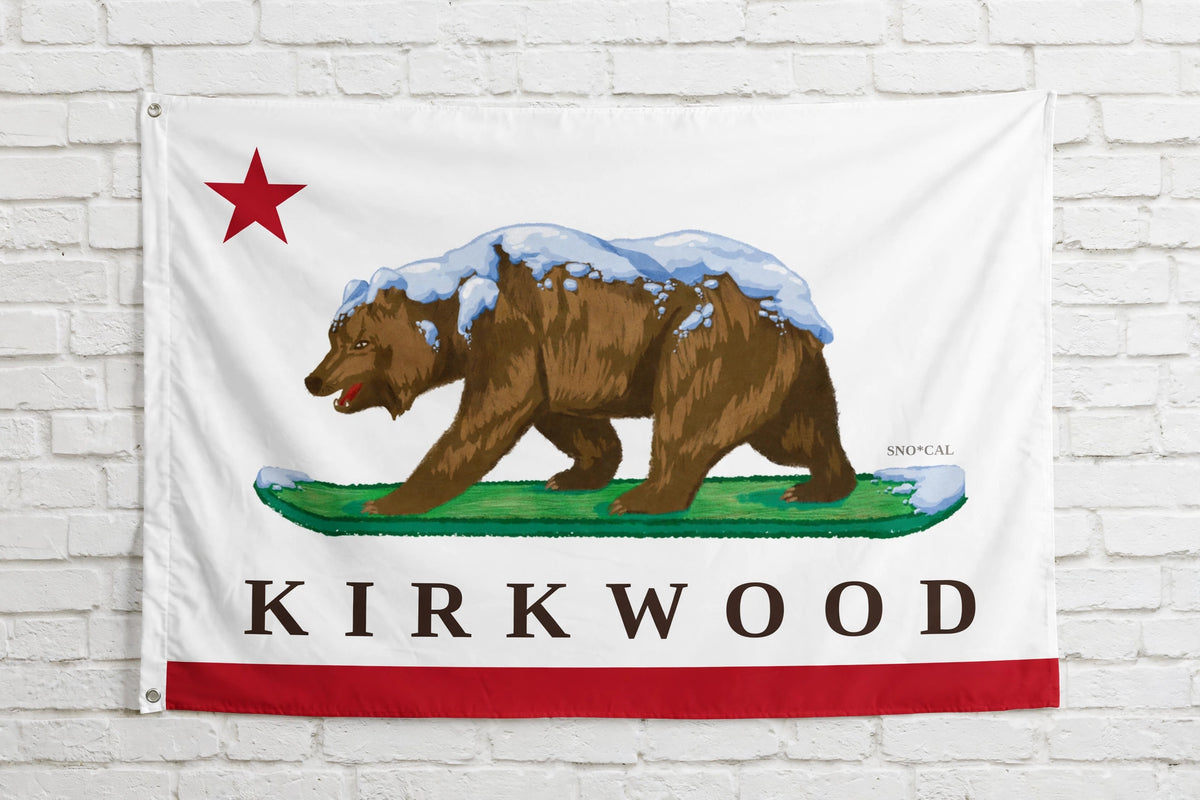 Kirkwood 3x5 ski flag hanging on a white brick wall
