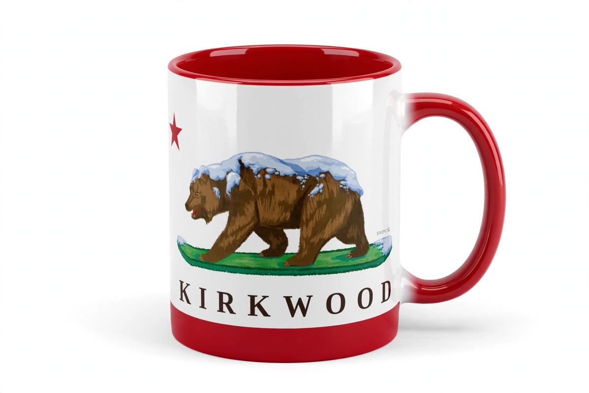 White ceramic mug with red rim handle and inside with Kirkwood CA flag design, grizzly bear walking on a snowboard, front view